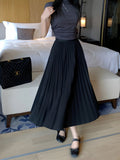 Falda Plisada Midi – Negro